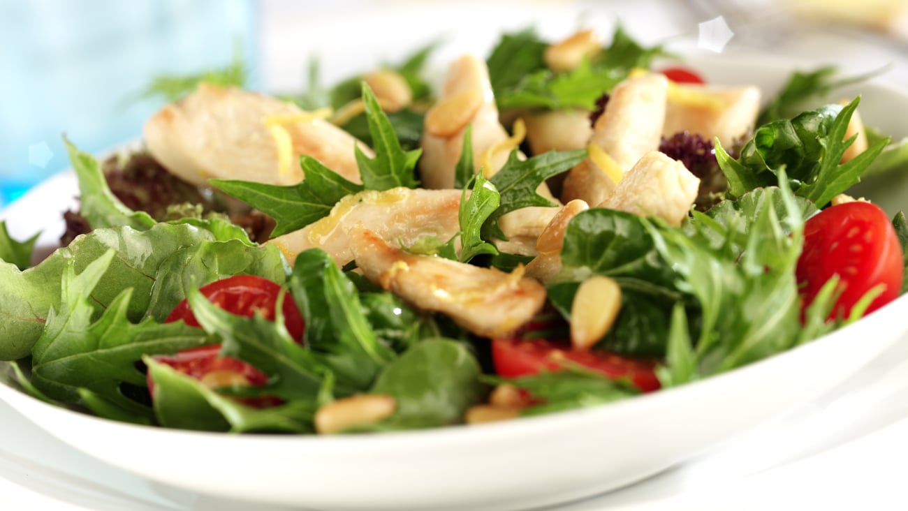 close up of green salad with chicken chunks