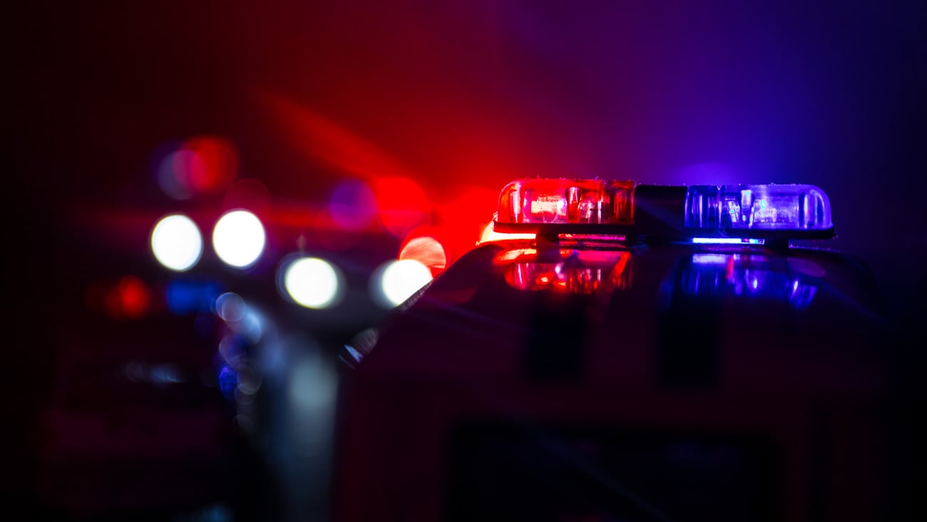 Police cars at night. Police car chasing a car at night with fog background. 911 Emergency response police car speeding to scene of crime. Selective focus; Shutterstock ID 1191163906