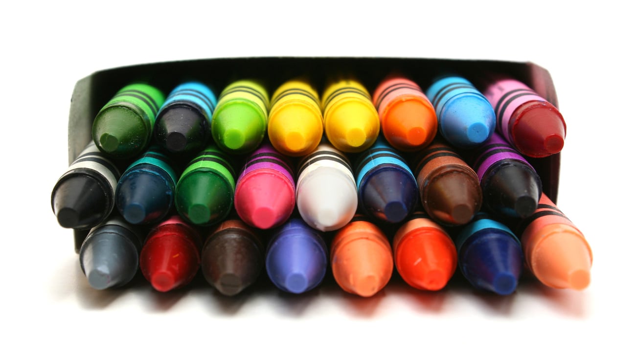 Front view of colorful crayons in white box against white background; Shutterstock ID 12220471