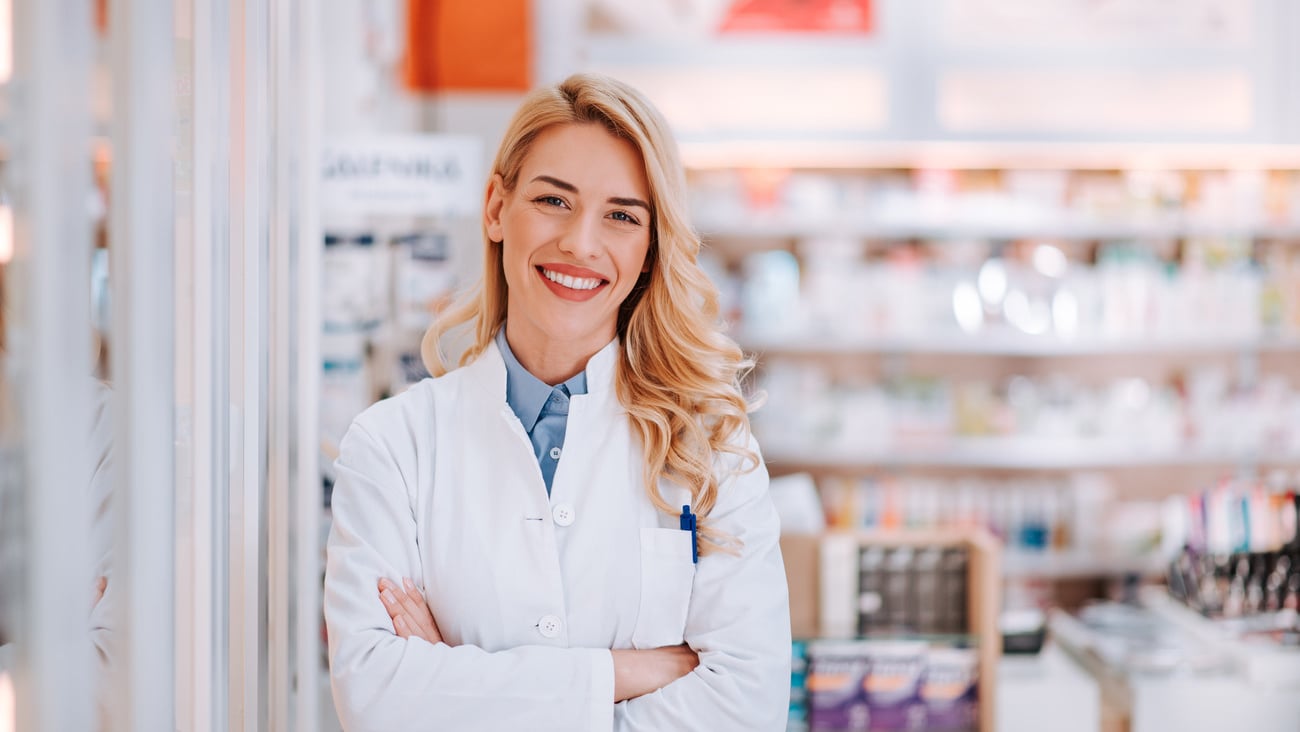 Portrait of a smiling healthcare worker in modern pharmacy.; Shutterstock ID 1329217175