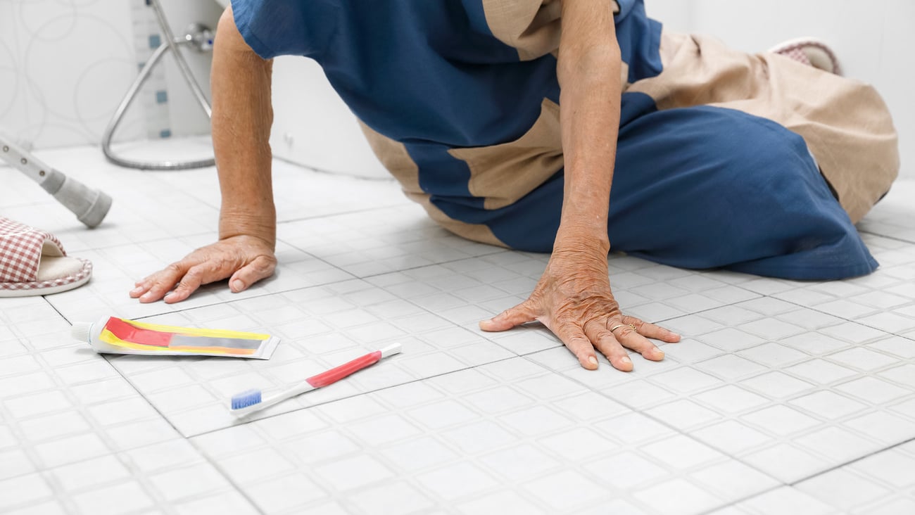 Elderly woman falling in bathroom because slippery surfaces; Shutterstock ID 1443886310