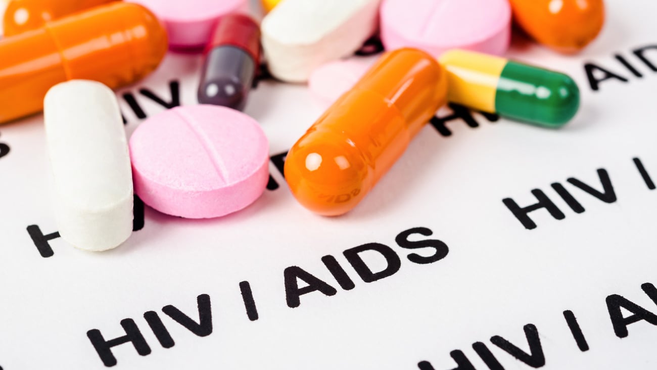 Pills on Hiv / aids paper background.; Shutterstock ID 1522630529
