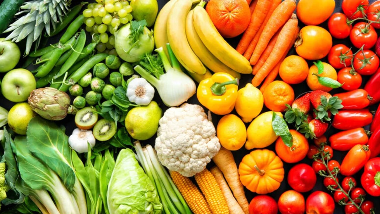 Panoramic food background with assortment of fresh organic fruits and vegetables in rainbow colors; Shutterstock ID 1633432321