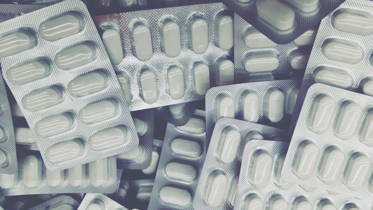 packaging of silvery tablets in purple tones; Shutterstock ID 1689424147