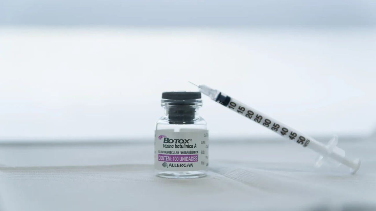 Porto Alegre , Brazil,April 10 - 2021: Botox glass medicine bottle,.Syringe of botulinum toxin, hualuronic, collagen or flu on a white background; Shutterstock ID 1957060963