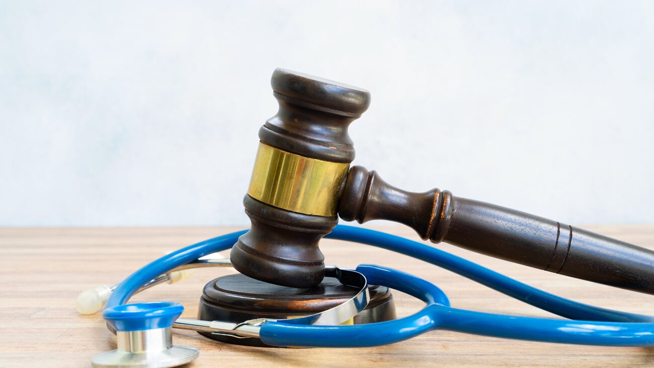 law gavel with sthetoscope, medical law concept; Shutterstock ID 1998552152