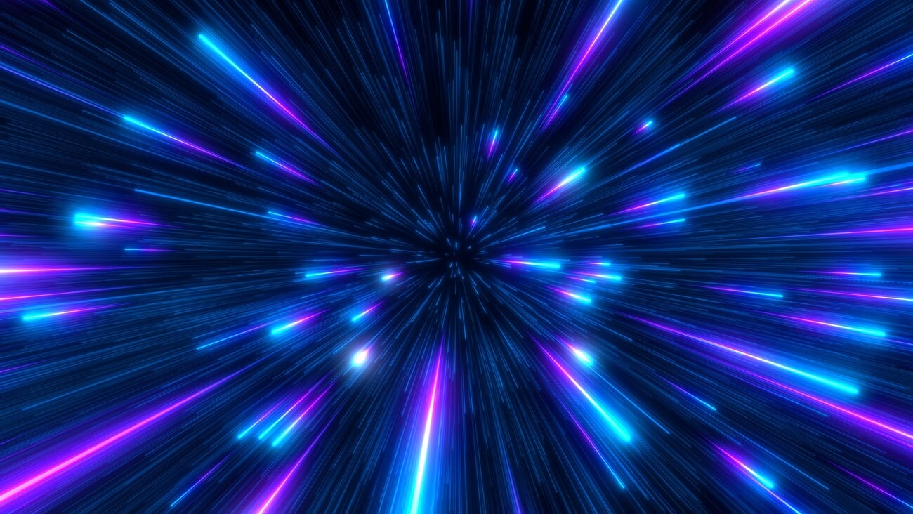 Abstract background in blue and purple neon glow colors on black. Speed of light in galaxy. Explosion in universe. Cosmic background for event, party, carnival, celebration, anniversary or other.; Shutterstock ID 2070469883