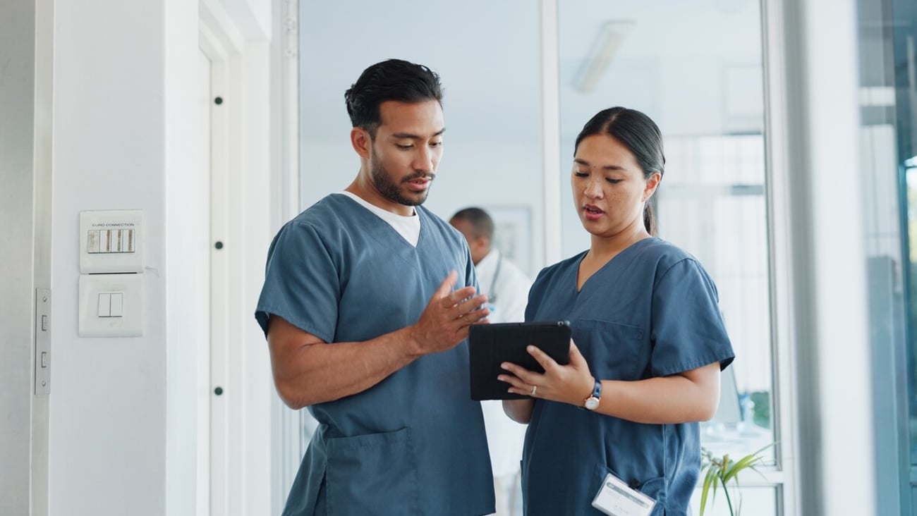 Medical advice, help and doctors with a tablet for healthcare, research and medicine planning. Communication, collaboration and men working in cardiology talking about surgery results on technology; Shutterstock ID 2265615071