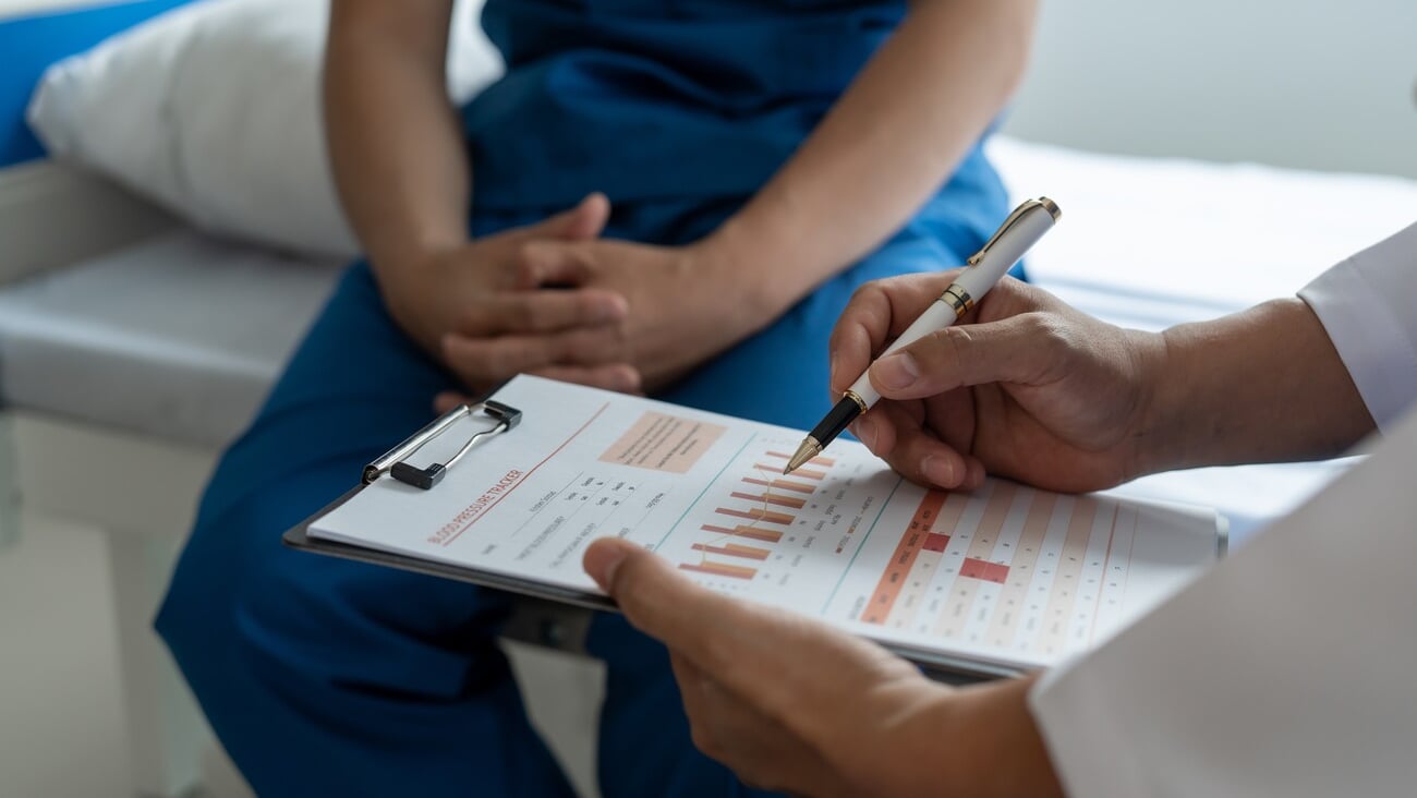 Prostate cancer specialist and testicular patient discuss testicular cancer test report Testicular and Prostate Cancer Infertility, EPAD - European Prostate Cancer Awareness Day; Shutterstock ID 2304082697