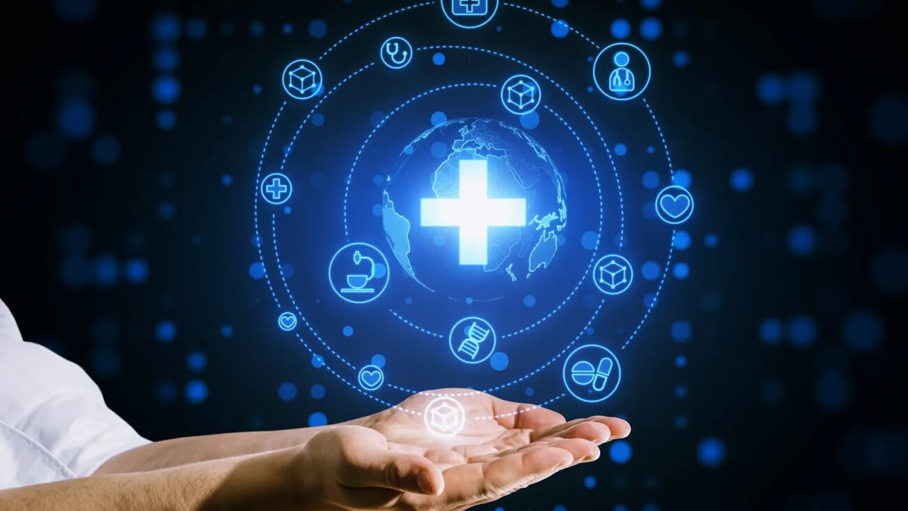 Close up of businessman hands holding creative glowing blue medical hologram with cross and globe on blurry background. Science, healthcare system and futuristic pharmacy concept; Shutterstock ID 2379163241