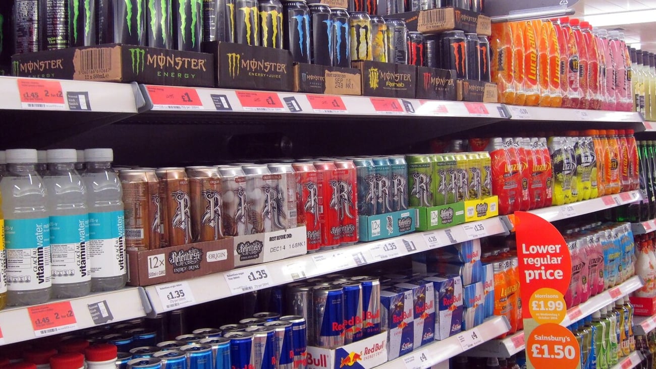 Energy drinks on display in an aisle in a supermarket or superstore. This is in Sainsburys store Bedford, United Kingdom. Taken on 4th October, 2014.                     ; Shutterstock ID 2422653309