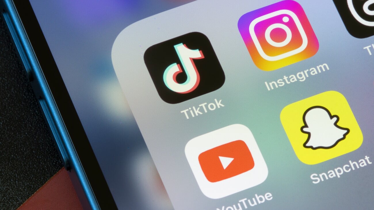 Portland, OR, USA - Mar 7, 2024: TikTok, Instagram, YouTube, and Snapchat app icons are seen on an iPhone. TikTok vs Instagram Reels vs YouTube Shorts vs Snap Spotlight concepts.; Shutterstock ID 2434965491