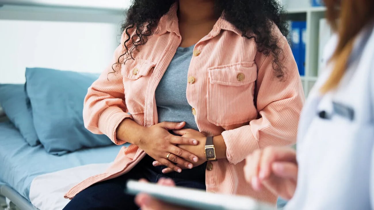 Pain, gynecologist and doctor with woman in hospital for consulting, appointment and endometriosis. Healthcare, clinic and person with patient for miscarriage, medical service and fertility crisis; Shutterstock ID 2731362333