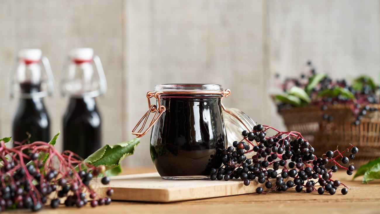 jars of elderberry juice and berries