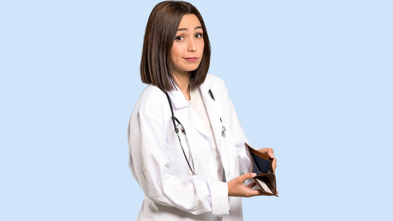 young female doctor holding empty wallet