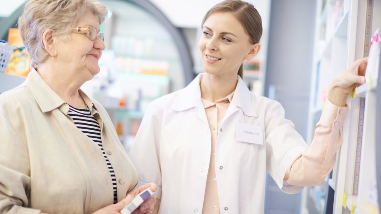 pharmacist taking care about mature woman health