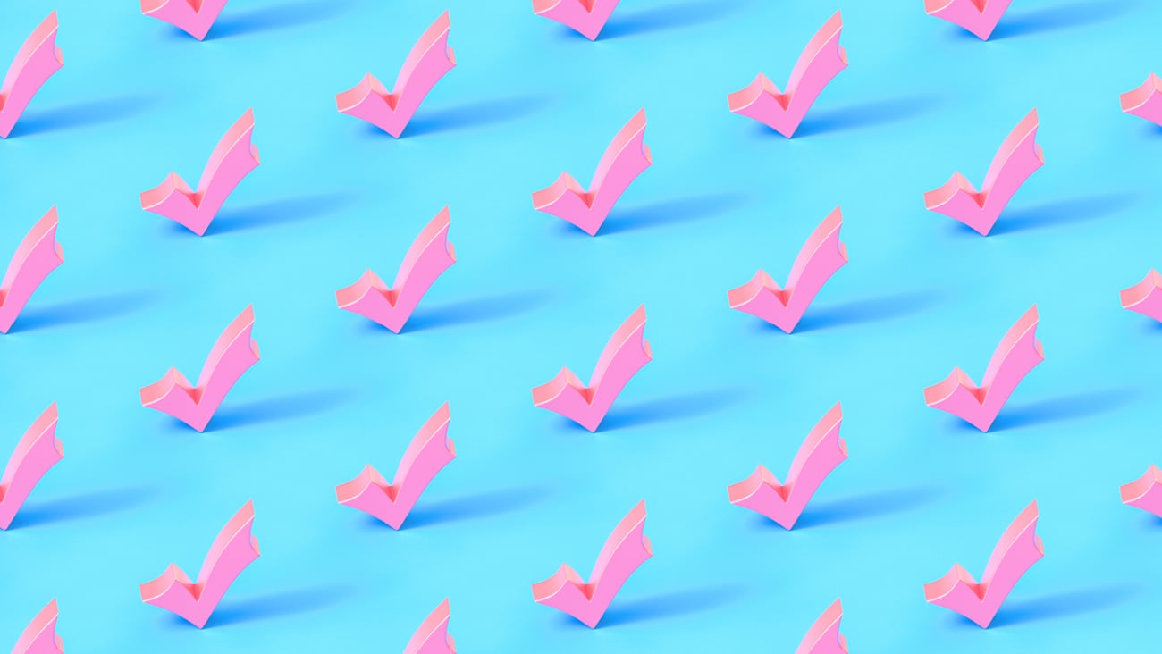 Wallpaper of pink checkmarks on a bright blue background