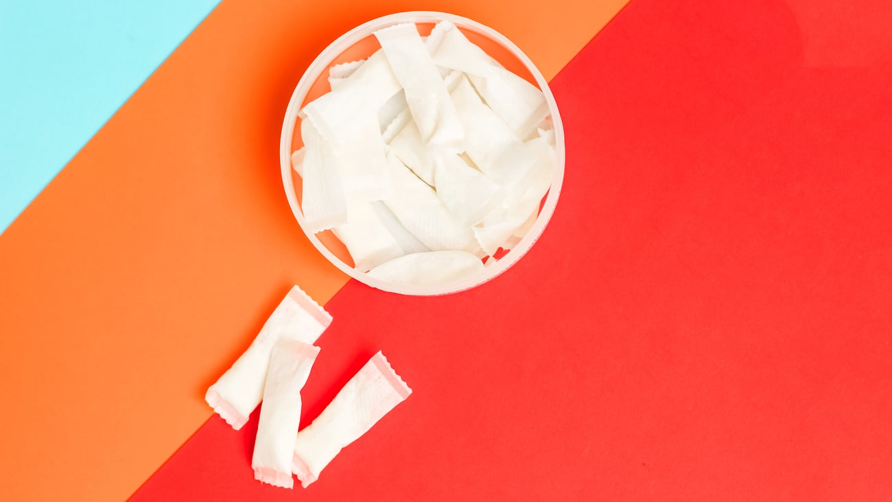 Nicotine pouches on orange background