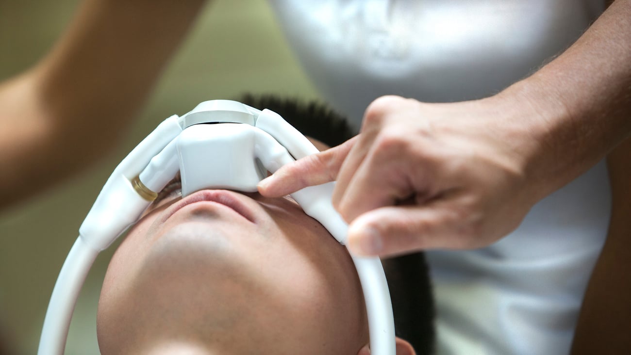 Young man being administered laughing gas