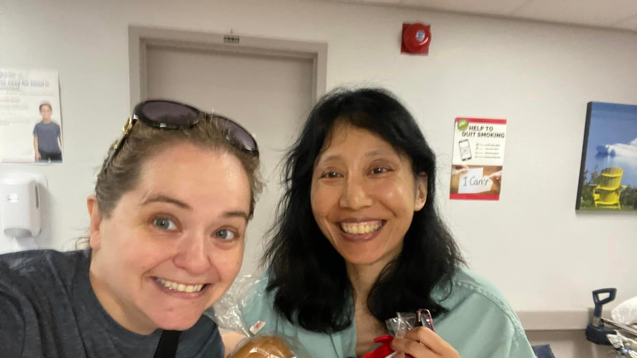 Two women with cookies. Dr. Mel Murphy and Dr. Melissa Yuan-Innes