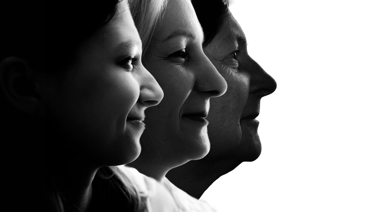 faces of woman of different ages in black-and-white profile