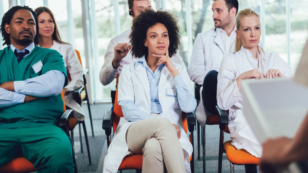 Group of doctors on seminar in lecture hall at hospital. Hospital, profession, people and medicine concept; Shutterstock ID 1672824979