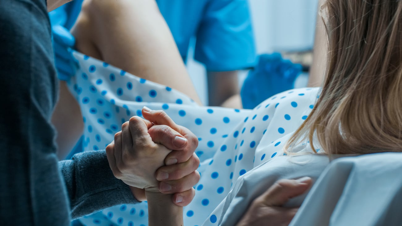 Emergency In the Hospital: Woman Giving Birth, Husband Holds Her Hand in Support, Obstetricians Assisting. Modern Delivery Ward with Professional Midwives.; Shutterstock ID 1181843014