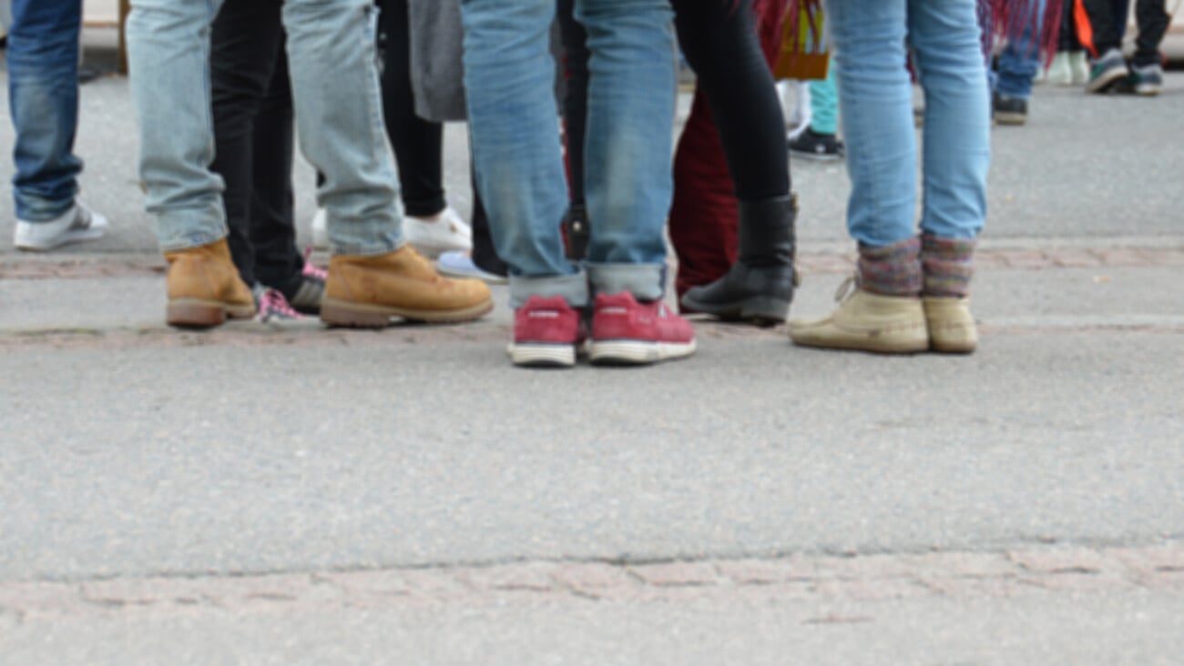 Young people on the street - slightly blurred image. Urban group of youngsters in a city. Youth gathering together in metropolitan area. Teens hanging around. Young adults.; Shutterstock ID 280812068