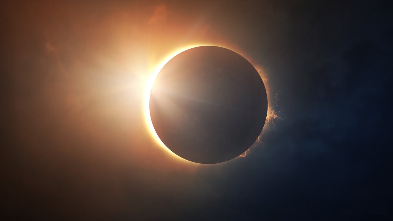 The moon covers the sun in a beautiful solar eclipse. Digital illustration; Shutterstock ID 686788690