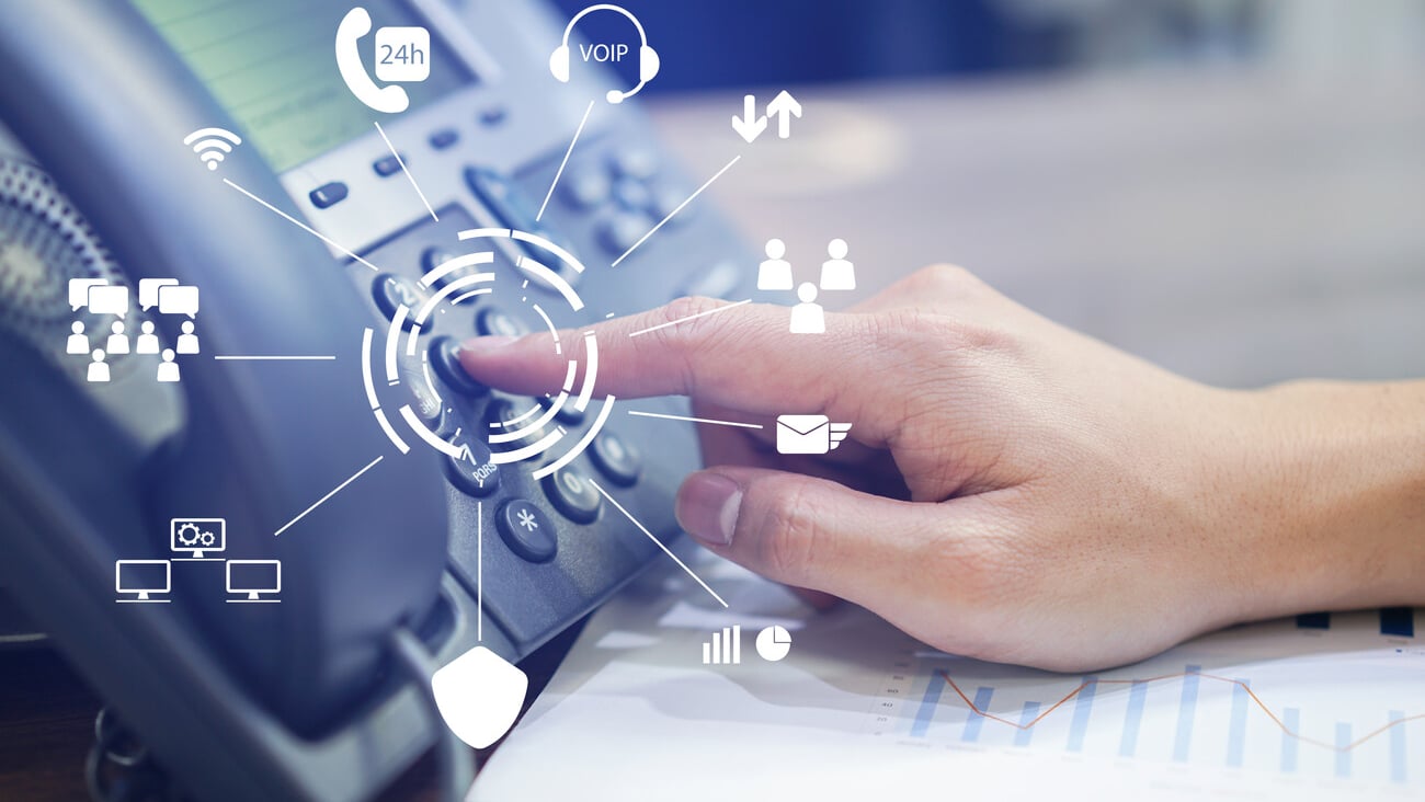 close up employee call center man hand point to press button number on telephone office desk with virtual communication technology concept; Shutterstock ID 1142418437