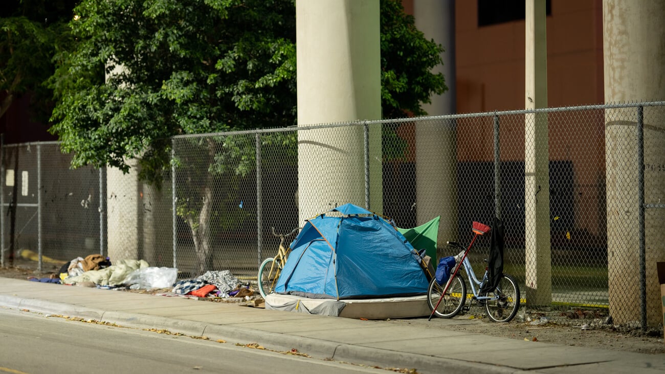 MIAMI, FL, USA - MARCH 10, 2021: Tents at Downtown Miami with homeless people living on the streets; Shutterstock ID 1936276033