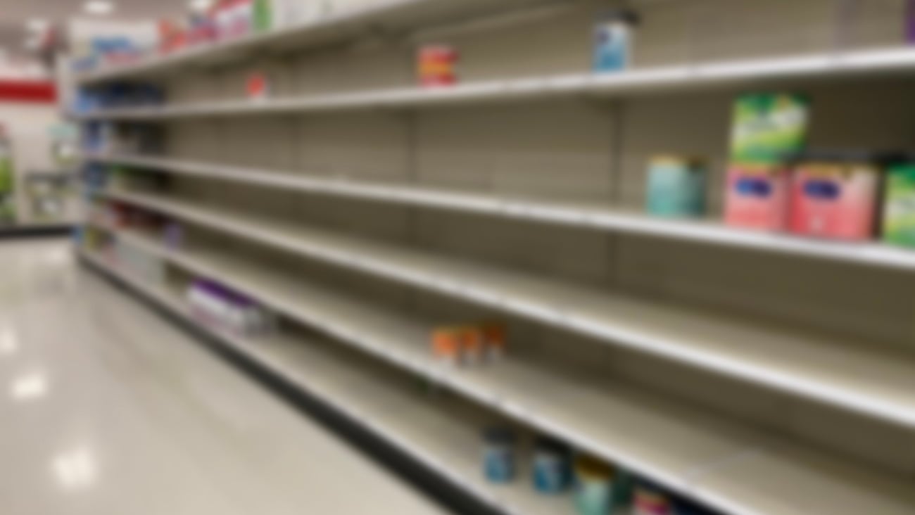 A baby formula display sits empty at supermarket as a result of nationwide baby formula shortage. Abstract blur. ; Shutterstock ID 2155140587