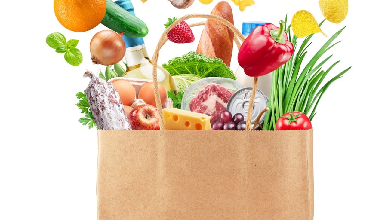 Food or groceries flying out from paper shopping  bag  on white background. File contains clipping paths.; Shutterstock ID 2447474789