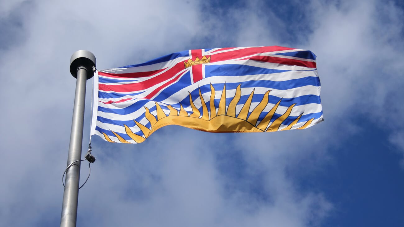 Flag of British Columbia against blue sky; Shutterstock ID 4222768