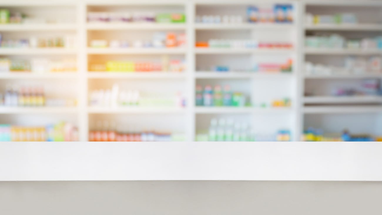 pharmacy drugstore background with wood counter; Shutterstock ID 490488754