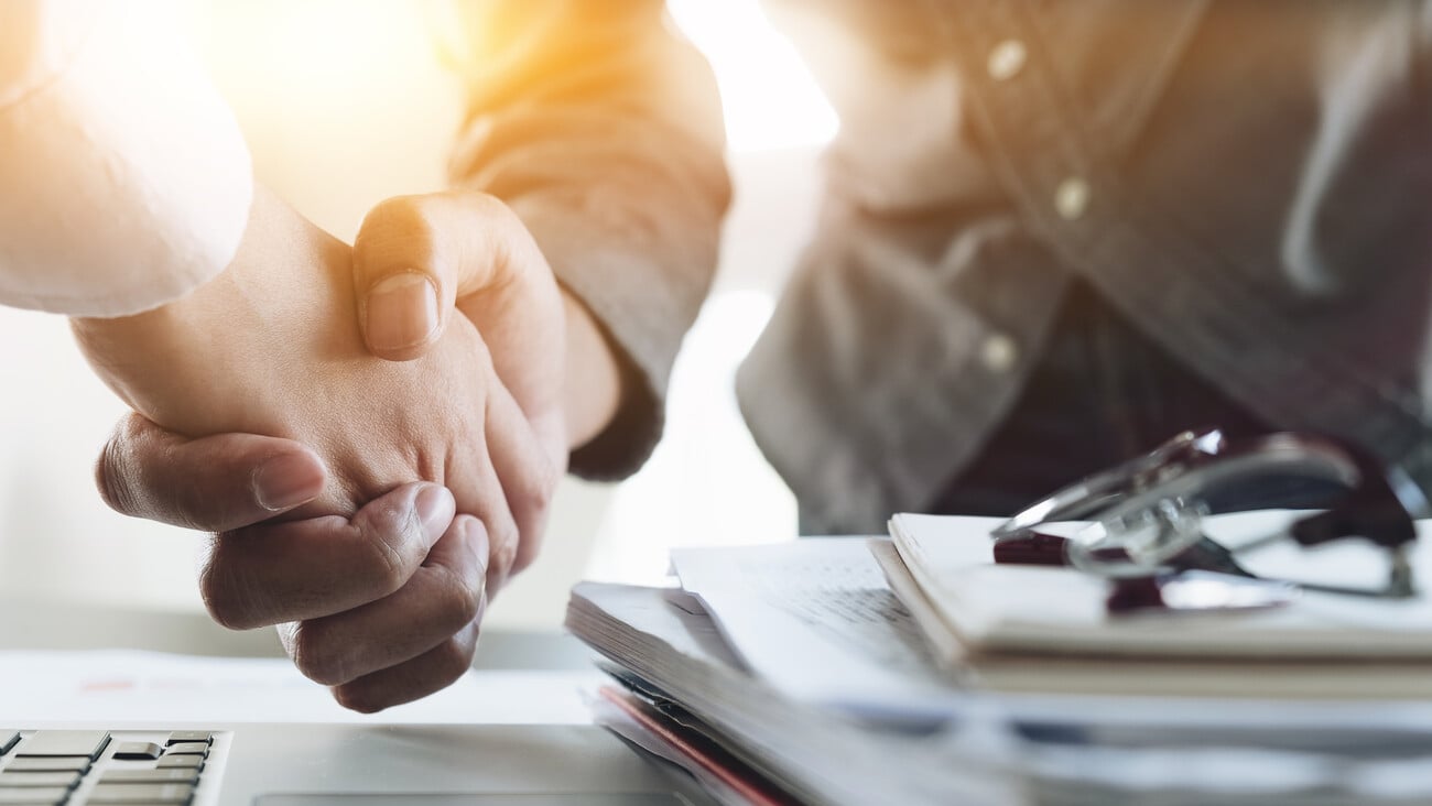 Close up of Business people shaking hands, finishing up meeting, business etiquette, congratulation, merger and acquisition concept; Shutterstock ID 734792920