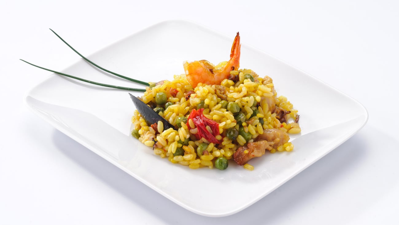 Paella, typical Spanish dish on white background; Shutterstock ID 96754894