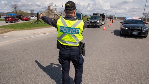 police officer guarding provincial border