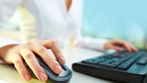 a person using a mouse and keyboard