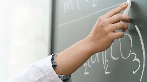 chemical equations on chalkboard