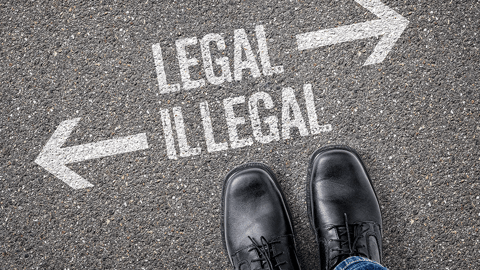 signs on street pointing to legal vs illegal