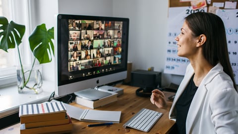 a person standing in front of a computer