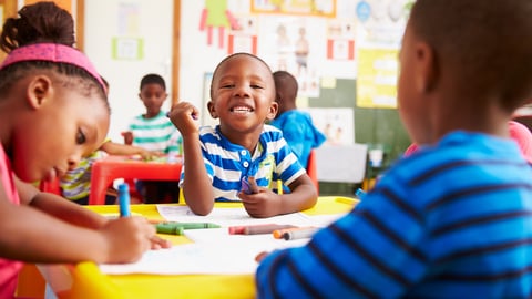 a small child sitting on a table