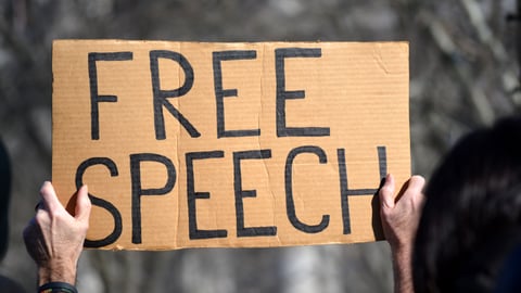 a man holding a sign