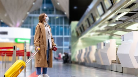 a man holding a bag of luggage