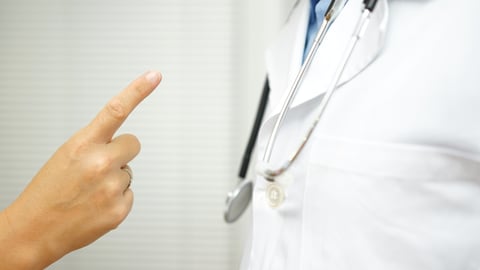 Finger pointed at doctor