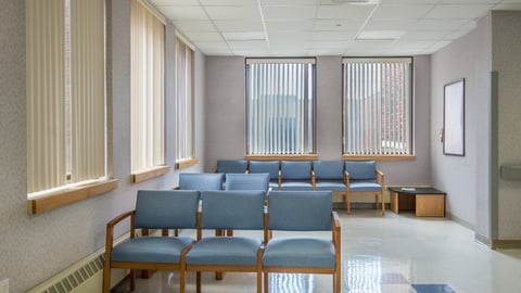 a room filled with furniture and a large window