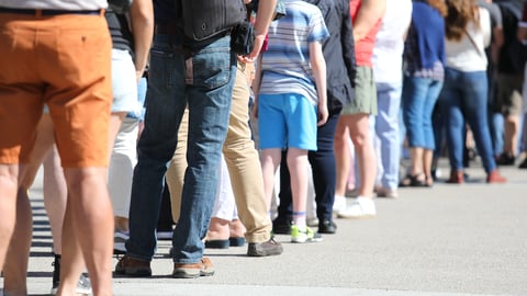 a group of people walking down the street
