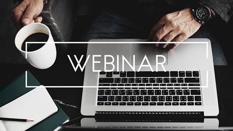 man at his computer attending a webinar