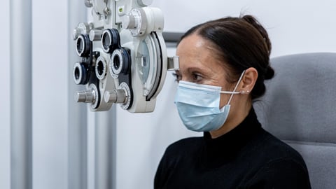 a person standing in front of a mirror posing for the camera